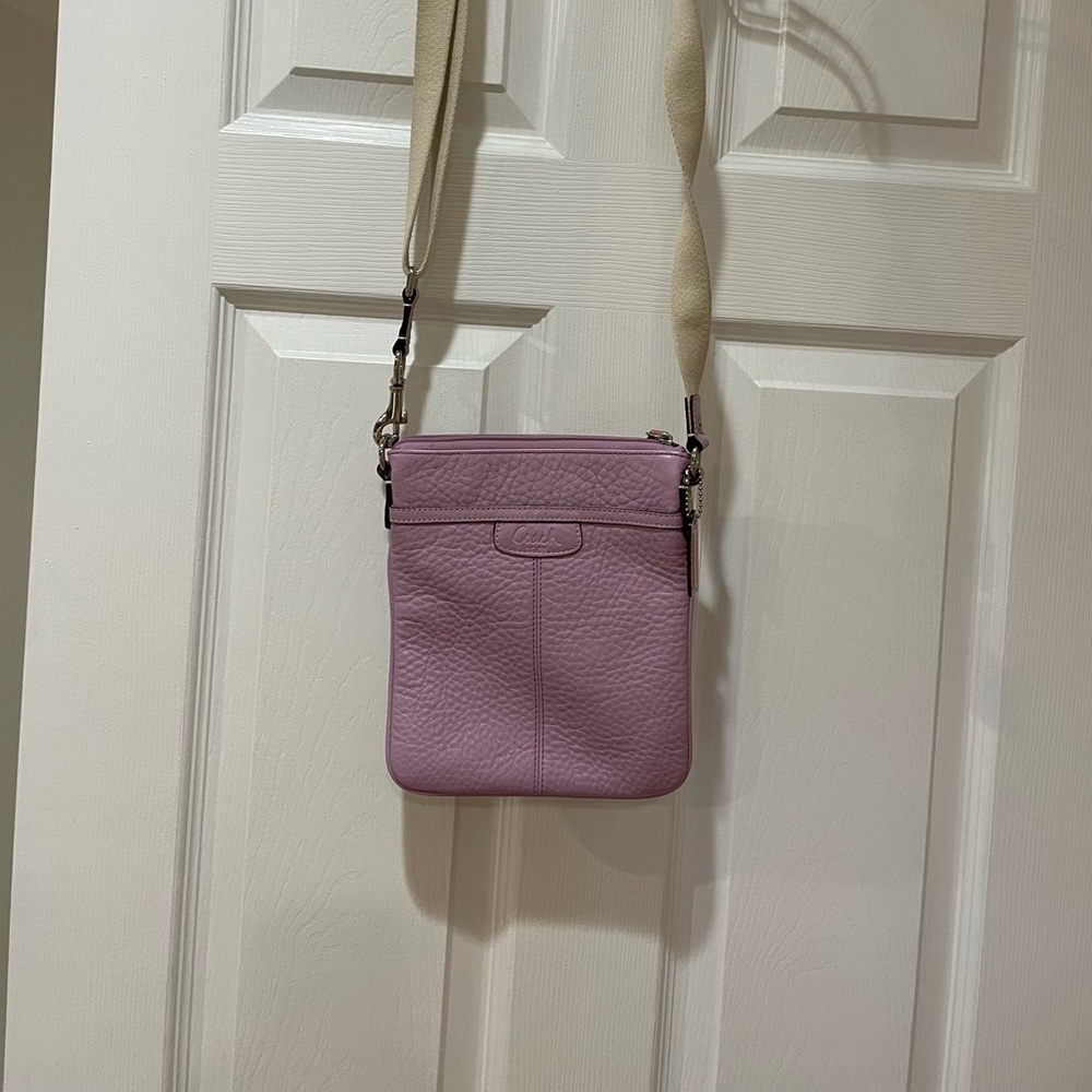 9 long by 7 1/2 wide adorable lavender coach purse only used twice